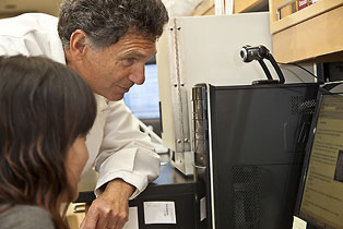 Dr. Donald Forthal consults with a student in his research laboratory at UC Irvine