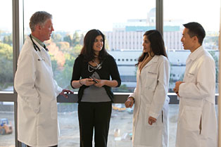 Dr. George Lawry and Dr. Shaista Malik confer with members of UC Irvine's rheumatology fellowship program.